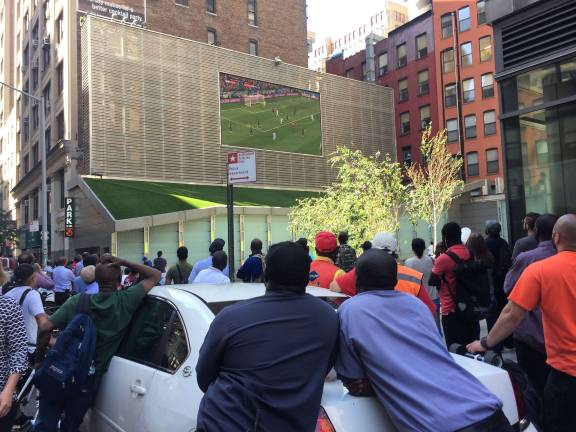 Watching the World Cup on West 29th Street. Photo: Michael Garofalo