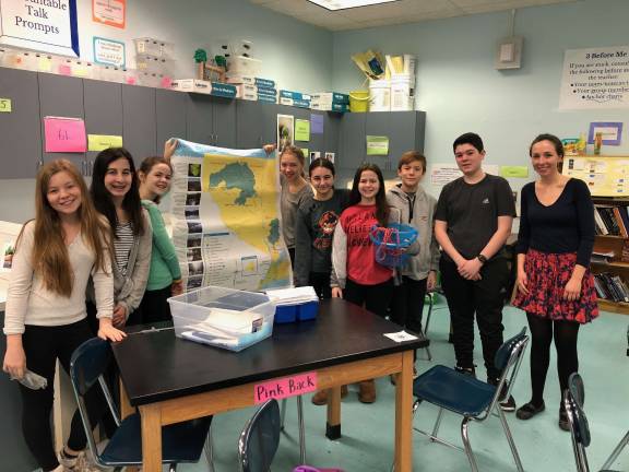 West End Secondary School’s Green Team poses with their oyster research equipment and an exhibition chart. Photo: Ashad Hajela