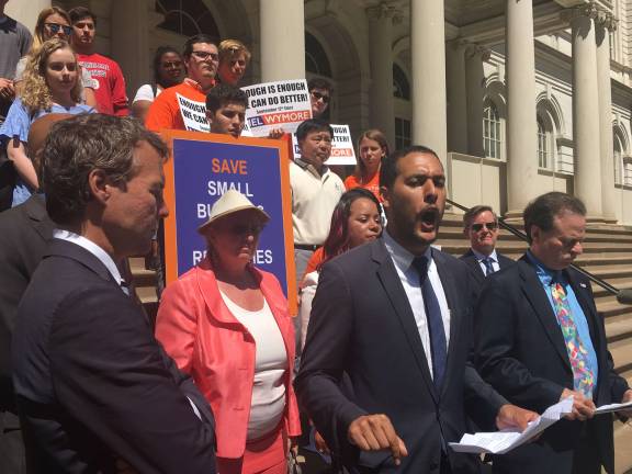 Christopher Marte, who is running for City Council District 1, spoke out in support of small businesses at a rally Wednesday afternoon. The political hopeful promised to prioritize the passage of the Small Business Jobs Survival Act if elected. Photo: Madeleine Thompson