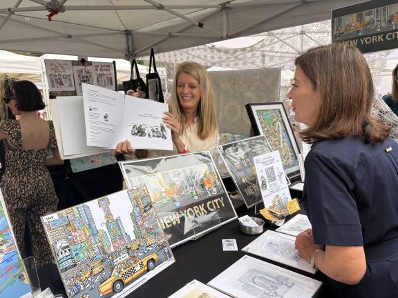 Kristin Doney showed Gov. Hochul her upcoming children's book about New York.