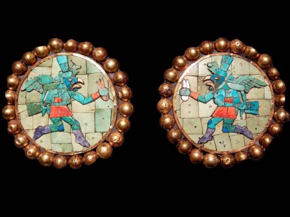 A pair of ear ornaments from the Moche people of Peru (made in A.D. 400–700) depicting winged messengers is one of the highlights of the exhibition. Photo: Adel Gorgy