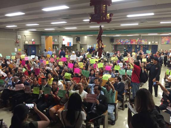 Dozens of Chinatown residents turned out to a Sept. 12 meeting at P.S. 124 to voice their opposition to the city's plan to build a 1,510-bed jail at 80 Centre Street. Photo: Michael Garofalo