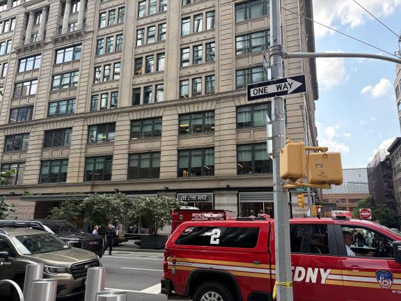 Police and fire vehicles could still be seen outside of the 315 Hudson Street office building at 3:40 p.m. Aug. 28.