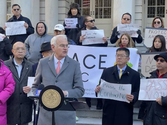 City Councilmember Bob Holden rallying in front of New York City Hall on Dec. 11, to promote a bill that would mandate licenses for e-bikes and other mopeds.