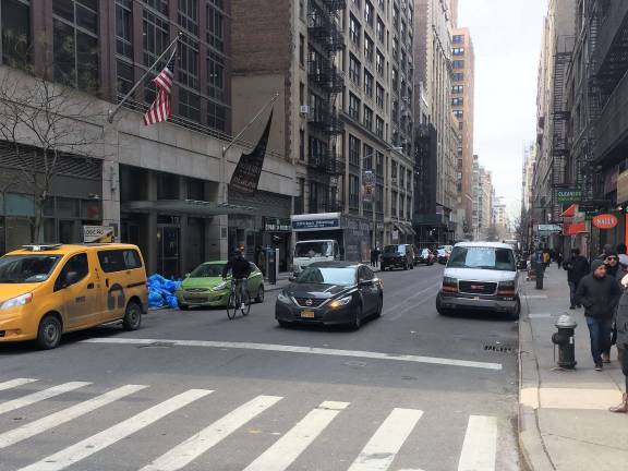 City officials unveiled plans last week to implement protected bike lanes on 26th and 29th Streets, the first protected crosstown lanes in Manhattan that would span nearly river-to-river. 26th Street (pictured), currently does not have a bike lane, while 29th Street now features a painted bike lane. Photo: Michael Garofalo