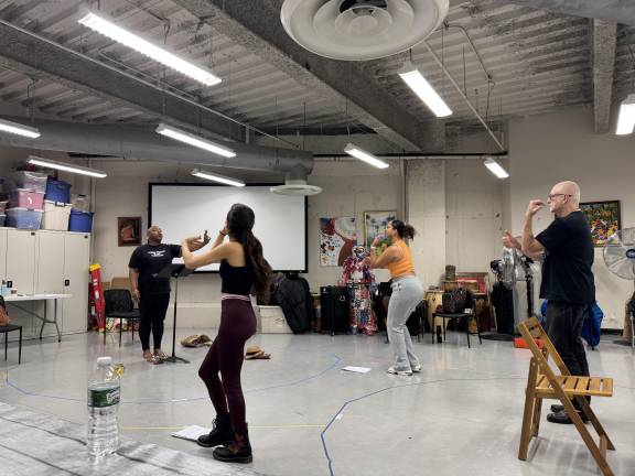 Cast of <i>Domino Effect </i>rehearses dance scene prior to their April opening.