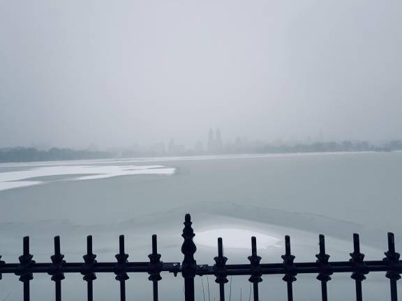 The Central Park reservoir looking west as the snowstorm swirls on Jan. 25.