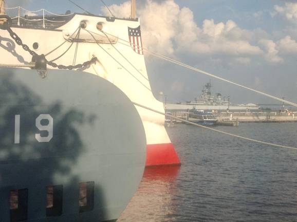 At the Independence Seaport Museum on Philadelphia’s Delaware River docks, the gray WWII submarine <i>USS Becuna</i> shows its bow against that of the 1898 <i>USS Olympia,</i> the oldest steel American warship afloat.
