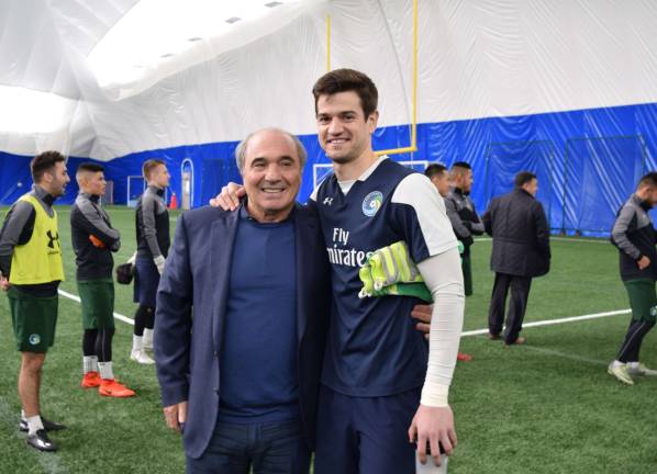 New York Cosmos chairman Rocco B. Commisso (left) poses with goalkeeper Jimmy Maurer following a practice session at Columbia University&#x2019;s soccer stadium.