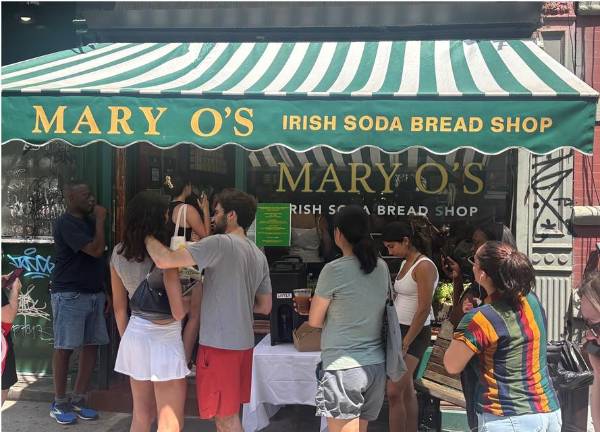 Long lines formed outside Mary O’s Irish Soda Bread Shop as owner Mary O’Halloran gave thanks to old and new friends with a free giveaway to each customer of two of her renowned scones. She urged customers to eat one and give the other away.