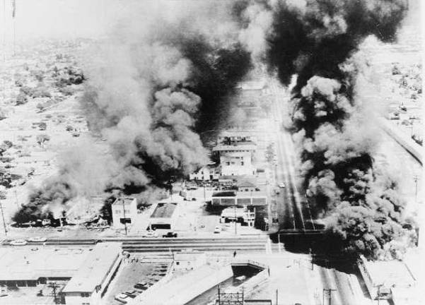 Burning buildings during the Watts riots in Los Angeles. Photo: Library of Congress.