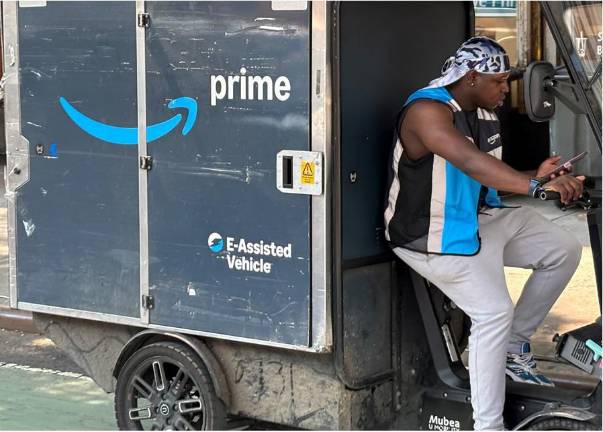 While they wear a vest with Amazon colors and drive trucks with Amazon Prime on it, the drivers are not technically Amazon employees.