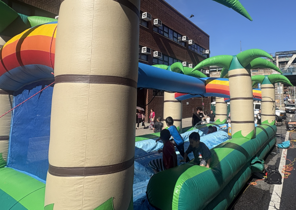 Children enjoy the water-filled bouncy house.