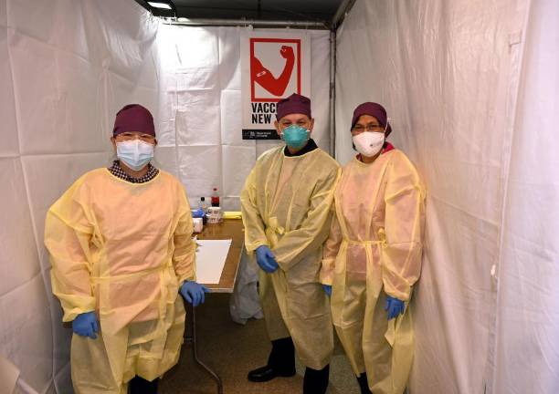 Medical staff at a NYCHA vaccine pop-up site at the William Reid Apartments in Brooklyn on Saturday, January 23, 2021. Photo: Kevin P. Coughlin / Office of Governor Andrew M. Cuomo