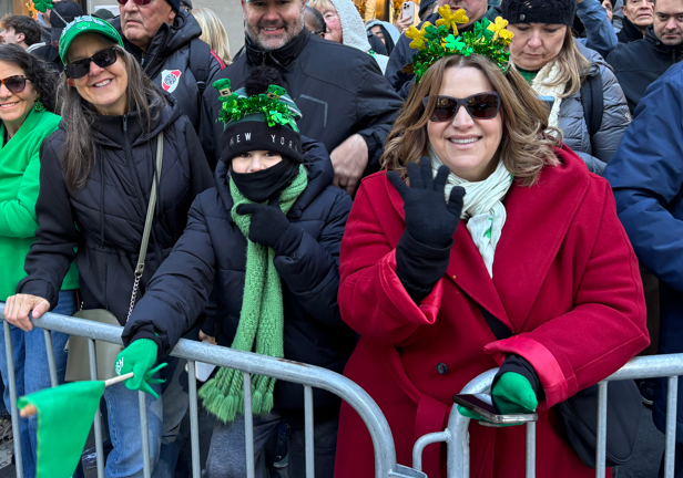 The McCourt family (from left) Patti McCourt, Christian McCourt and his mom, Melissa McCourt (red coat) all flew in from Port St. Lucie, FL. “It’s really cool,” said Christian and we assume he meant the parade and not the weather.