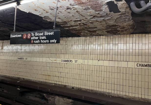Against the 1962-installed western wall, Chambers Street J/Z train riders bound for Fulton or Broad Streets need to look up to make sure nothing falls on them. Renovation is on the way, but with the MTA just start to solicit proposals for a $100 million contract to renovate two stations, it will be at least two years for any rehabilitation. Photo: Ralph Spielman