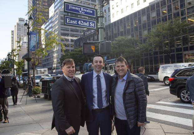 East Side City Council Member Keith Powers is flanked by James Breslin (at left) and his twin brother Kevin at the Oct. 17 unveiling of “Jimmy Breslin Way” on a stretch of East 42nd Street near the landmark Daily News Building. Photo: New York City Council Photographer John McCarten