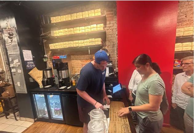 Patrick O’Halloran, one of Mary O’Halloran kids, recently graduated from Trinity College, Dublin, but was back behind the counter of Mary O’s Irish Soda Bread Shop as the pub gave thanks by giving away two free scones to every customer as a way to say thanks.