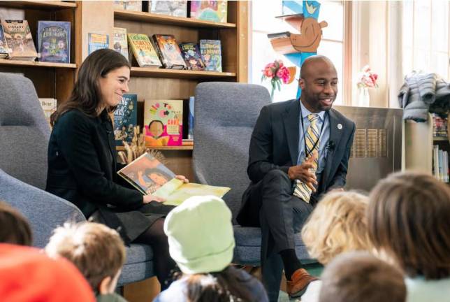 Schools Chancellor Kamar Samuels and Emmy Liss, executive director of the mayor’s Office of Child Care, read to students on Feb. 4. Samuels is planning to visit all five boroughs to hear from families and educators. (Courtesy of New York City Public Schools Press Office)