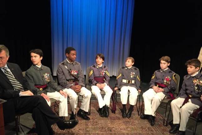 Some Knickerbocker cadets, sitting at attention.