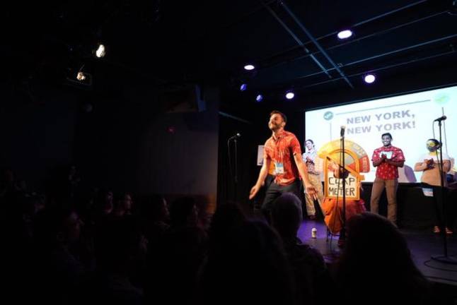 Nikolai Vanyo at the mic during the monthly pub fest, Punderdome. Photo: Punderdome