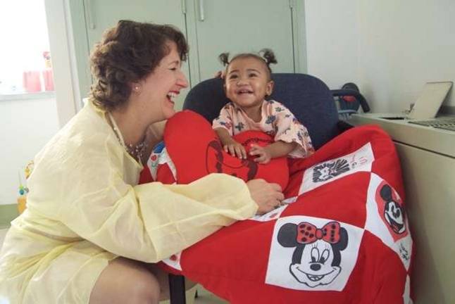 Lisa Buksbaum with a young patient at Beth Israel Medical Center. Photo: Angeline Eckbert