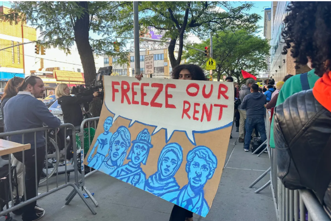 Protestor portrays workers urging the Rent Guidelines Board to vote a zero percent rent increase at a hearing May 7.