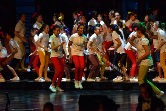 Francisco Nunez conducts The Young People's Chorus performing The Song I Sing for the Spring Gala at Rose Theater, Jazz at Lincoln Center, on March 5, 2018. Photo: Stephanie Berger.