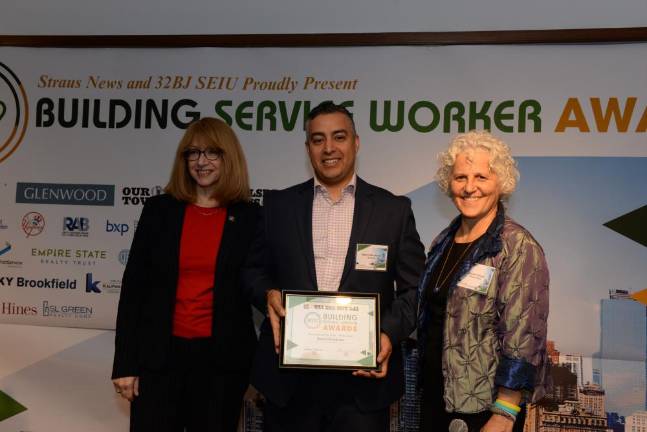 Hamid Mouhcine (center), Downtown Doorman of the Year, with State Assembly Member Linda Rosenthal and Jeanne Straus.