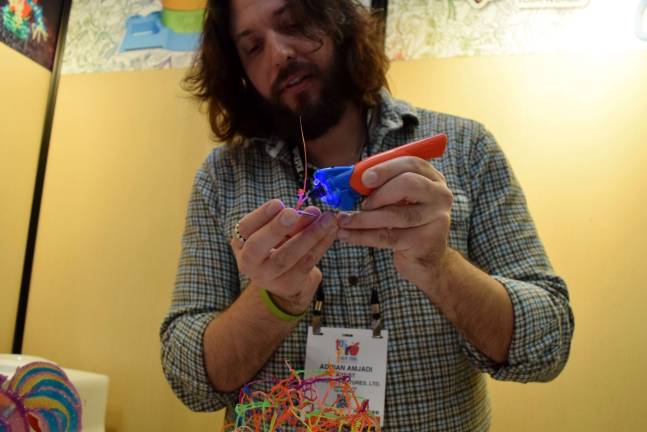 Adrian Amjadi of Redwood Ventures demonstrates a 3-D pen at the 2017 North American International Toy Fair. Photo: Michael Garofalo