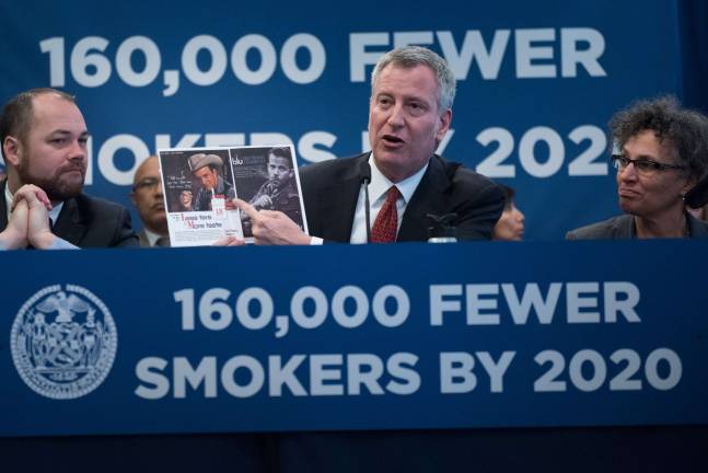Mayor Bill de Blasio, flanked by City Council Member Corey Johnson, left, and Health Department Commissioner Mary Bassett, right, announced legislation to curb smoking and tobacco usage during an April 19 press conference at the offices of the American Heart Association. Photo: Michael Appleton/Mayoral Photography Office