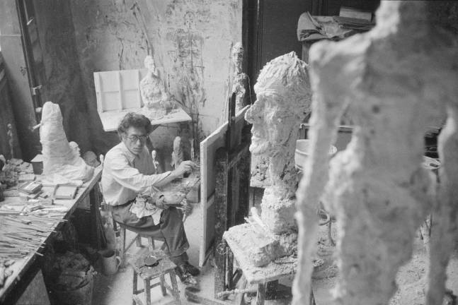 Alberto Giacometti painting in his Paris studio, 1958. Photo: Ernst Scheidegger. &#xa9; 2018 Stiftung Ernst Scheidegger&#x2013; Archiv, Z&#xfc;rich