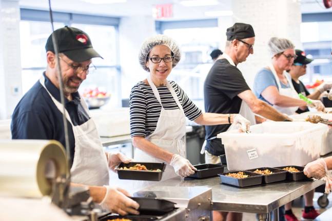 Preparing meals at God’s Love We Deliver. Photo: Nicola Bailey
