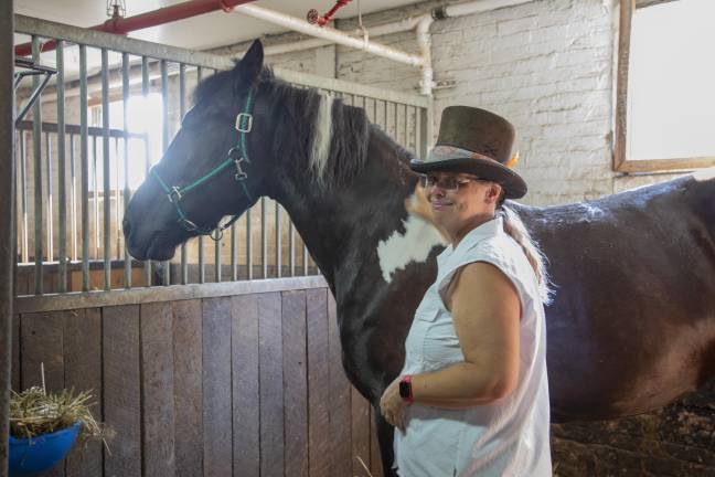 Christina Hansen, a carriage owner and spokesperson for the union, with Cheyenne the horse.