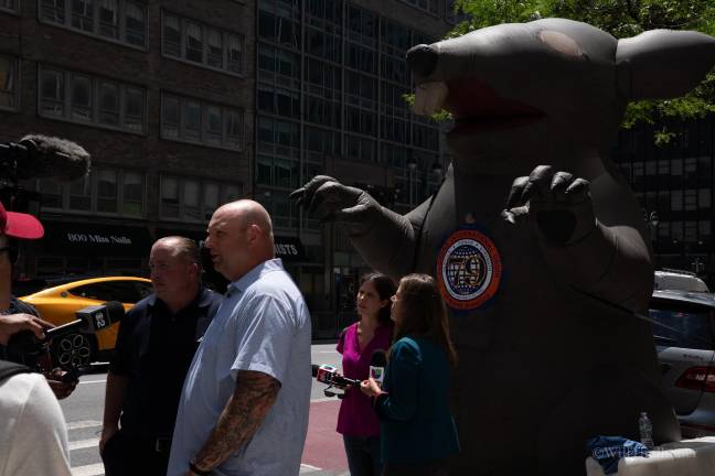 Two labor union organizers taking questions during rally on July 9, include Billy Irwin (left) and Mike Batter (right).