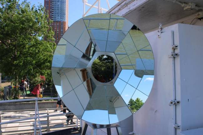 Graciela Cassel’s “radar kaleidoscope” is made of angled mirrors that reflect the surrounding river, sky, and city. Photo: Meryl Phair