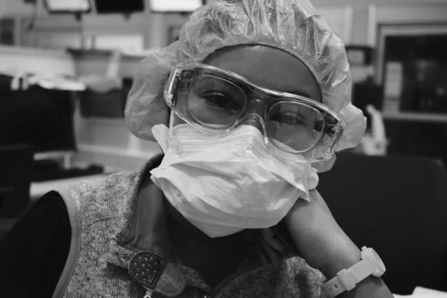 Grateful for camaraderie: ER nurse Addie Egan took photos of her colleagues at NYPresbyterian Weill Cornell Medical Center. Here, ED Tech Delis Cedeno.