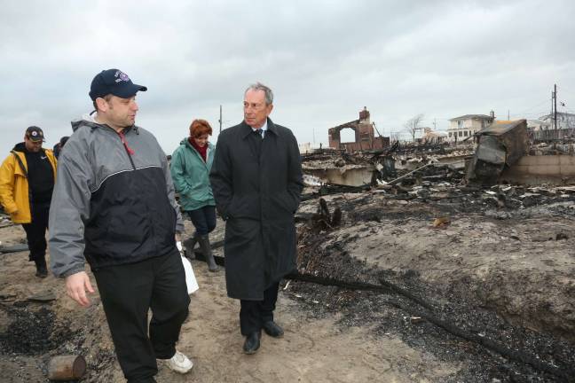 Then-Mayor Michael Bloomberg tours a neighborhood damaged by Hurricane Sandy in 2012. Photo: Edward Reed/Mayor’s Office of Photography