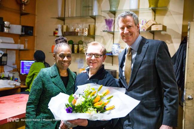 Joe Rizzo, the owner of Langdon Florist in Tribeca, holds a bouquet of wildflowers he prepared for two of his longtime customers, first lady Chirlane McCray and Mayor Bill de Blasio, during a farewell visit they paid to the shop near City Hall on February 27. He is relocating the 71-year-old institution to Staten Island and shuttered the shop at 62 Reade Street earlier this month. Photo: Benjamin Kanter, via Mayoral Photo Office
