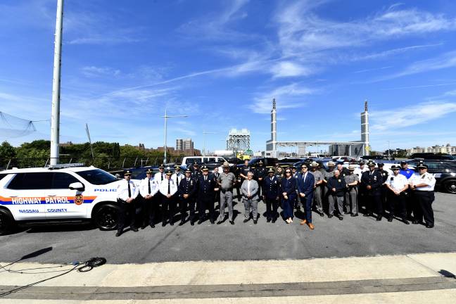 Law enforcement and MTA Bridges &amp; Tunnels President Catherine Sheridan at the RFK Bridge on Aug 19, 2025, commemorating the 100th operation of the ghost car task force.