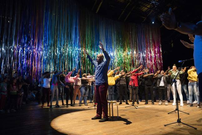 Baritone Jorell Williams and Vy Higginsen’s Sing Harlem Choir perform in Nick Cave’s “The Let Go” at the Park Ave Armory. Photo: James Ewing . Photo: James Ewing