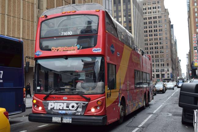 The City Council is considering legislation that would limit the number of sightseeing buses permitted on city streets at 225 — there are currently 197 buses licensed by the city. Photo: Michael Garofalo