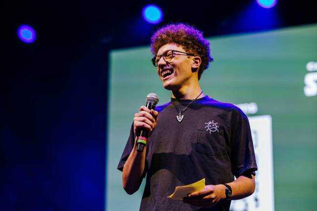 Ian McKinney, a 16-year-old environmental activist from LaGuardia High School, speaks to a crowd of nearly 3,000 at the SummerStage Music For Action benefit concert.