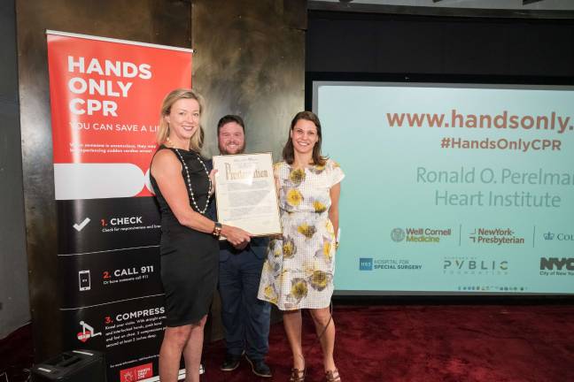 Dr. Holly S. Andersen holds a proclamation from Mayor Bill de Blasio honoring "Hands Only CPR Day." Photo courtesy of the Ronald O. Perelman Heart Institute