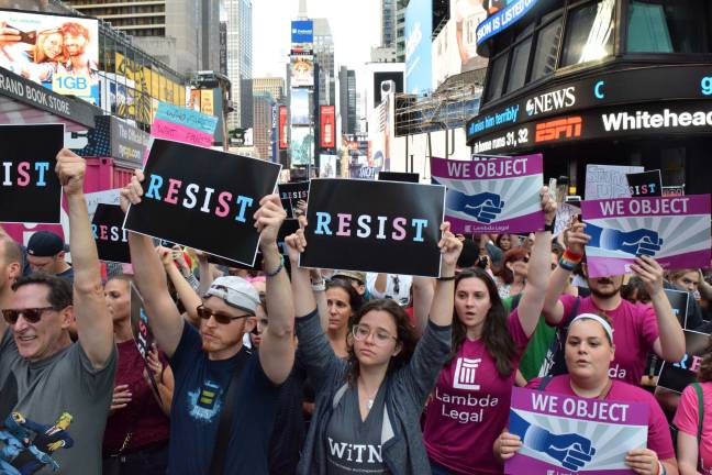 Hundreds of protesters assembled in Times Square Wednesday in response to President Trump’s announcement of a ban on transgender military service. Photo: Michael Garofalo