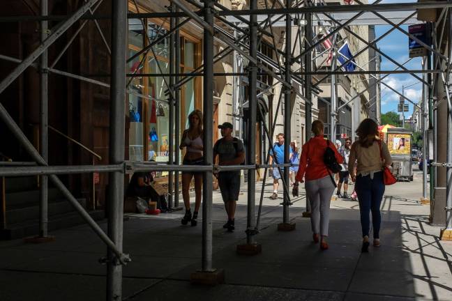 More than 7,500 sidewalk sheds shade New York City, mostly in Manhattan. A new map gives a better picture of the size and safety purposes of these common features. Photo: Steven Pisano, via Flickr