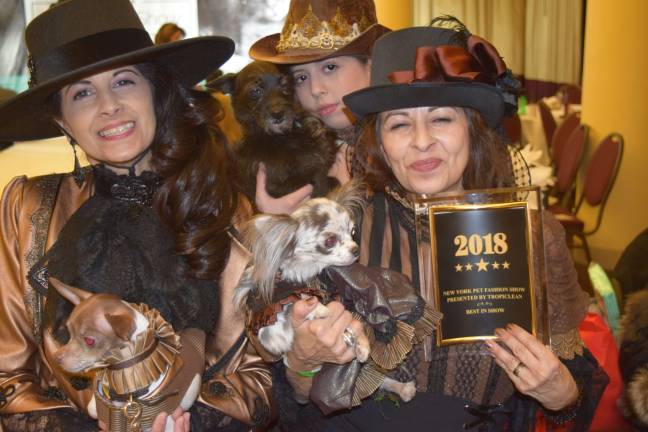 Best in show winner Elizabeth, Mason and Joanna Colon with models. Photo: Chris Dastoor