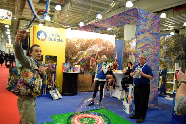 A conventioneer uses a bubble wand at the 2017 North American International Toy Fair. Photo: Michael Garofalo
