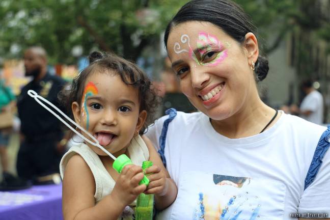 A mom with her daughter both enjoyed face painting at the 9th Pct. celebration of National Night Out on Aug. 5.
