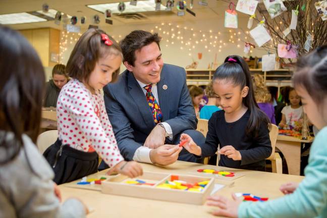 City Council Member Ben Kallos, who is running for reelection to his Upper East Side seat, with some of his youngest constituents this summer at the Manhattan Schoolhouse, a preschool in his district. Photo: Ben Kallos Campaign